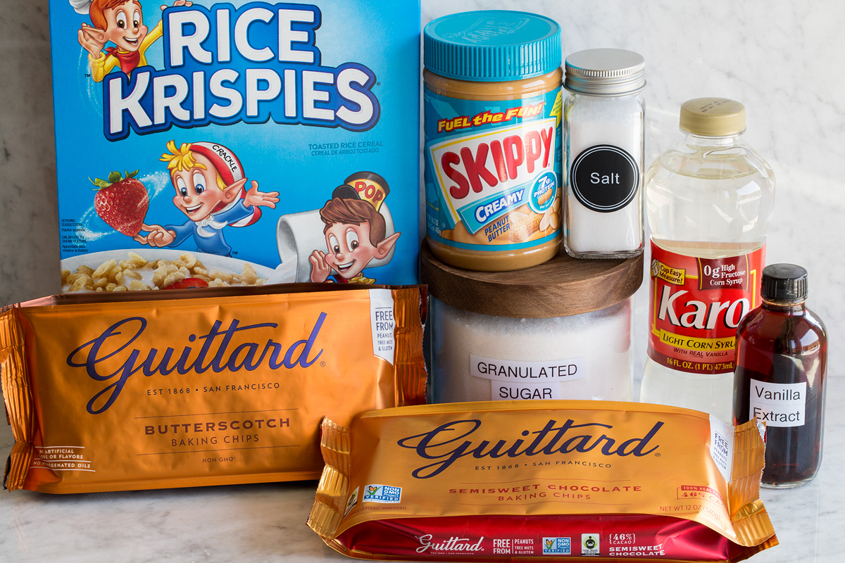 Scotcheroos Image of ingredients used to make scotcheroos. Includes rice krispies cereal, peanut butter, sugar, salt, corn syrup, dark chocolate chips and butterscotch chips.