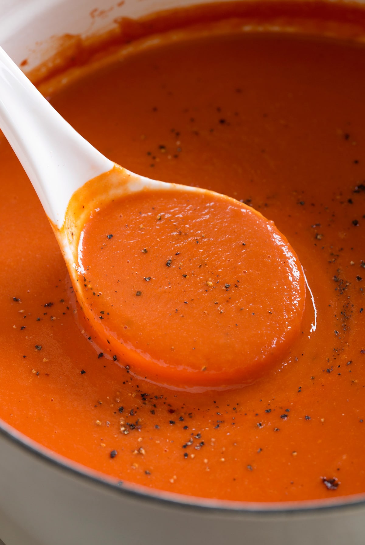 Homemade Tomato Soup Ladle filled with homemade tomato soup.