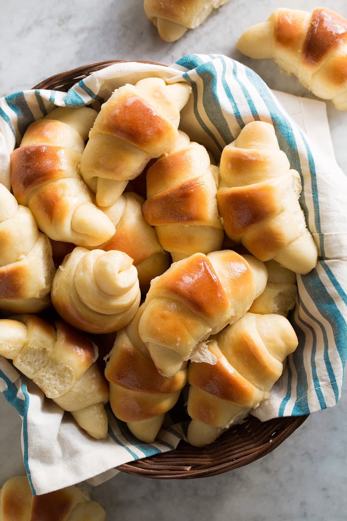 Best Dinner Rolls Overhead image of dinner rolls in a wicker serving basket.