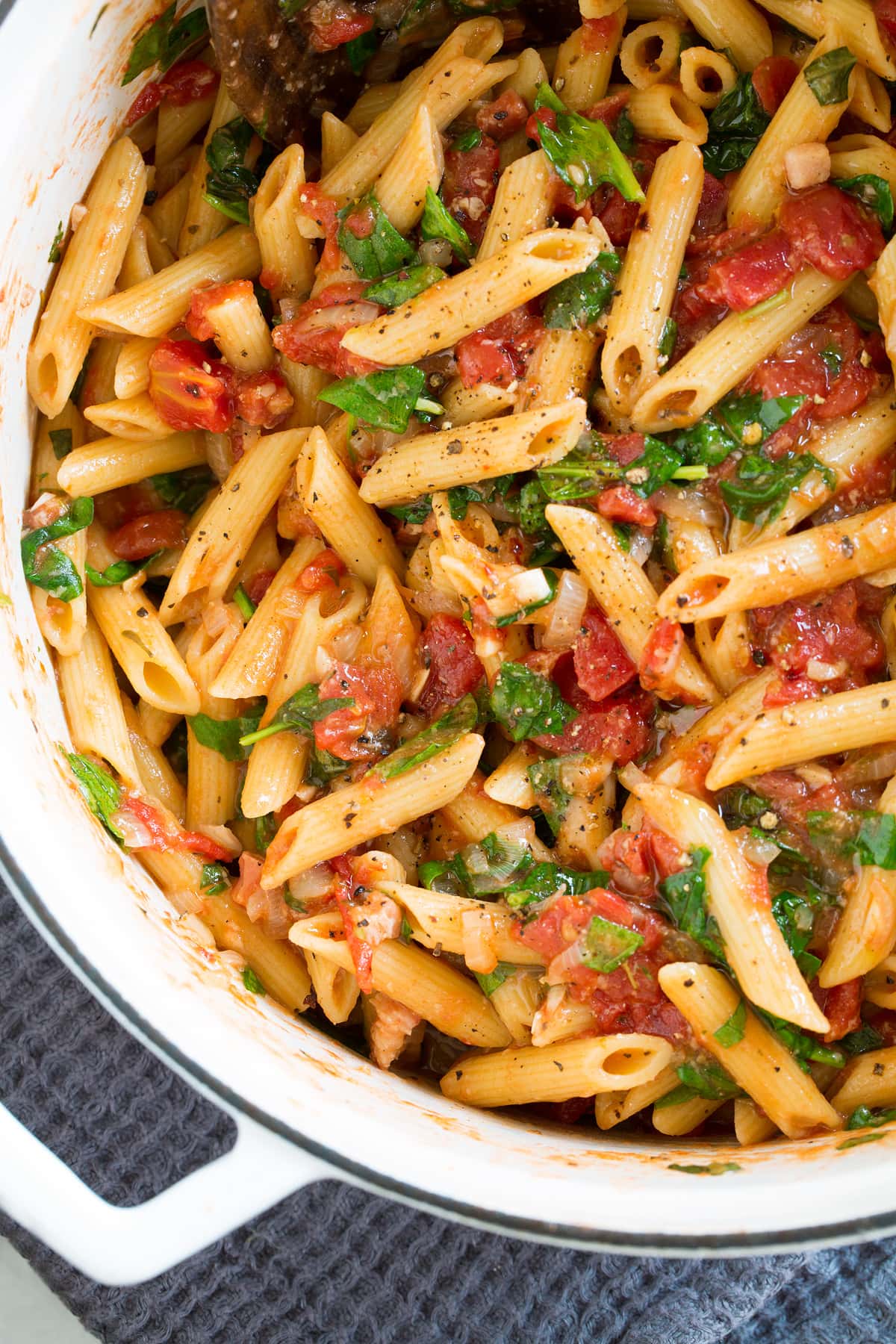 One Pot Pasta Close up photo of one pot pasta in a large white pot.