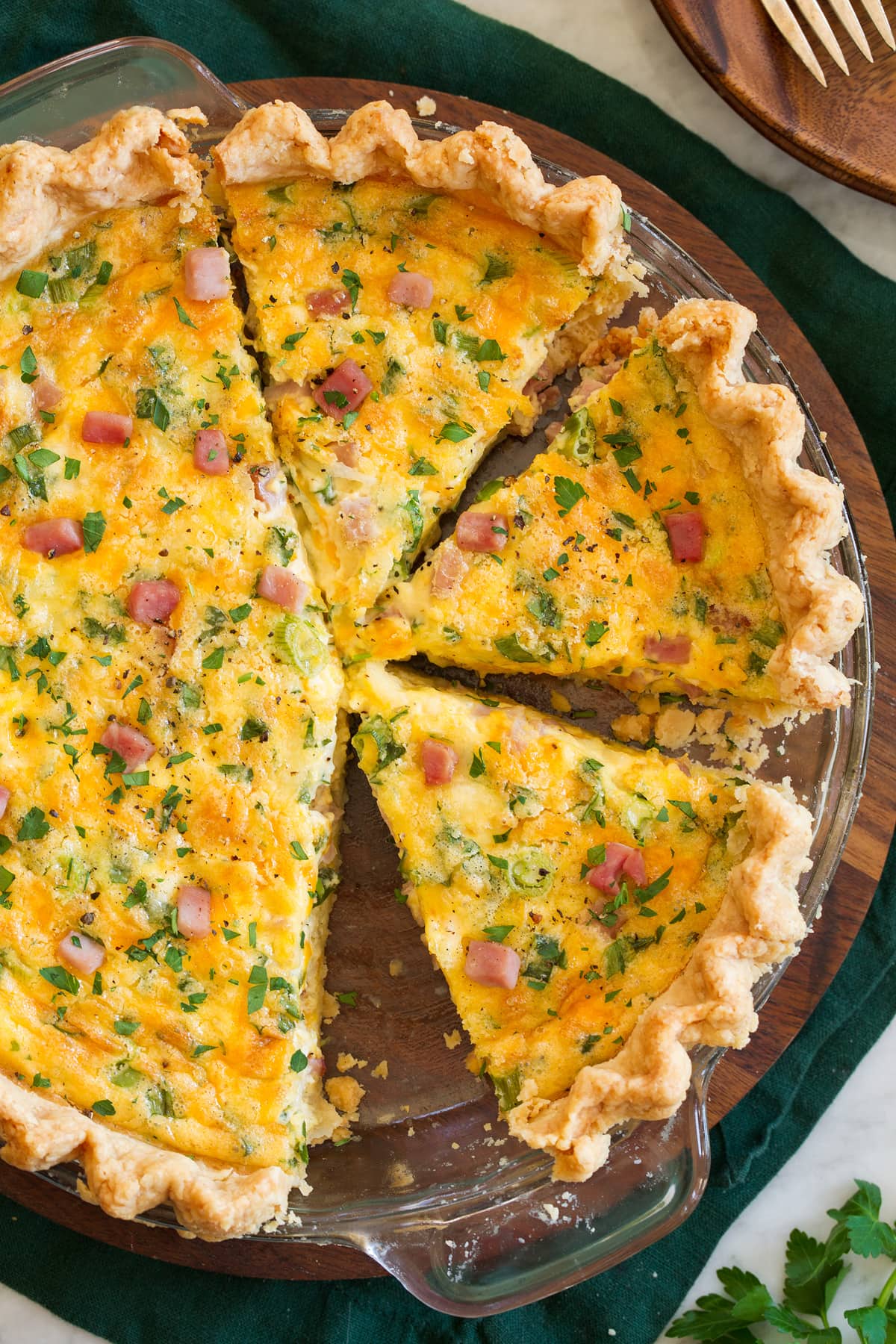 Quiche Overhead photo of sliced quiche in a glass pie pan.