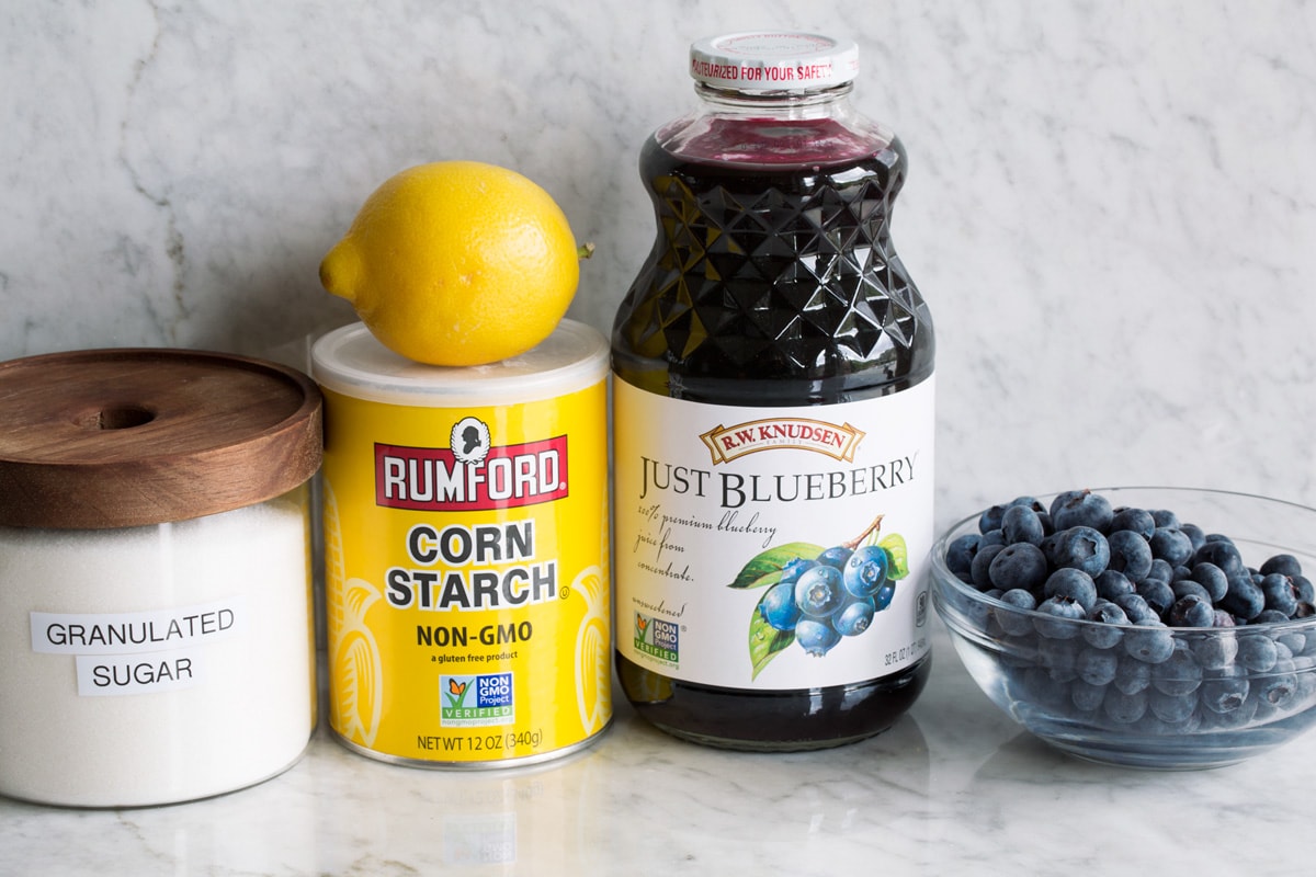 Blueberry Syrup Ingredients used to make blueberry syrup. Includes blueberries, blueberry juice, cornstarch, lemon and sugar.
