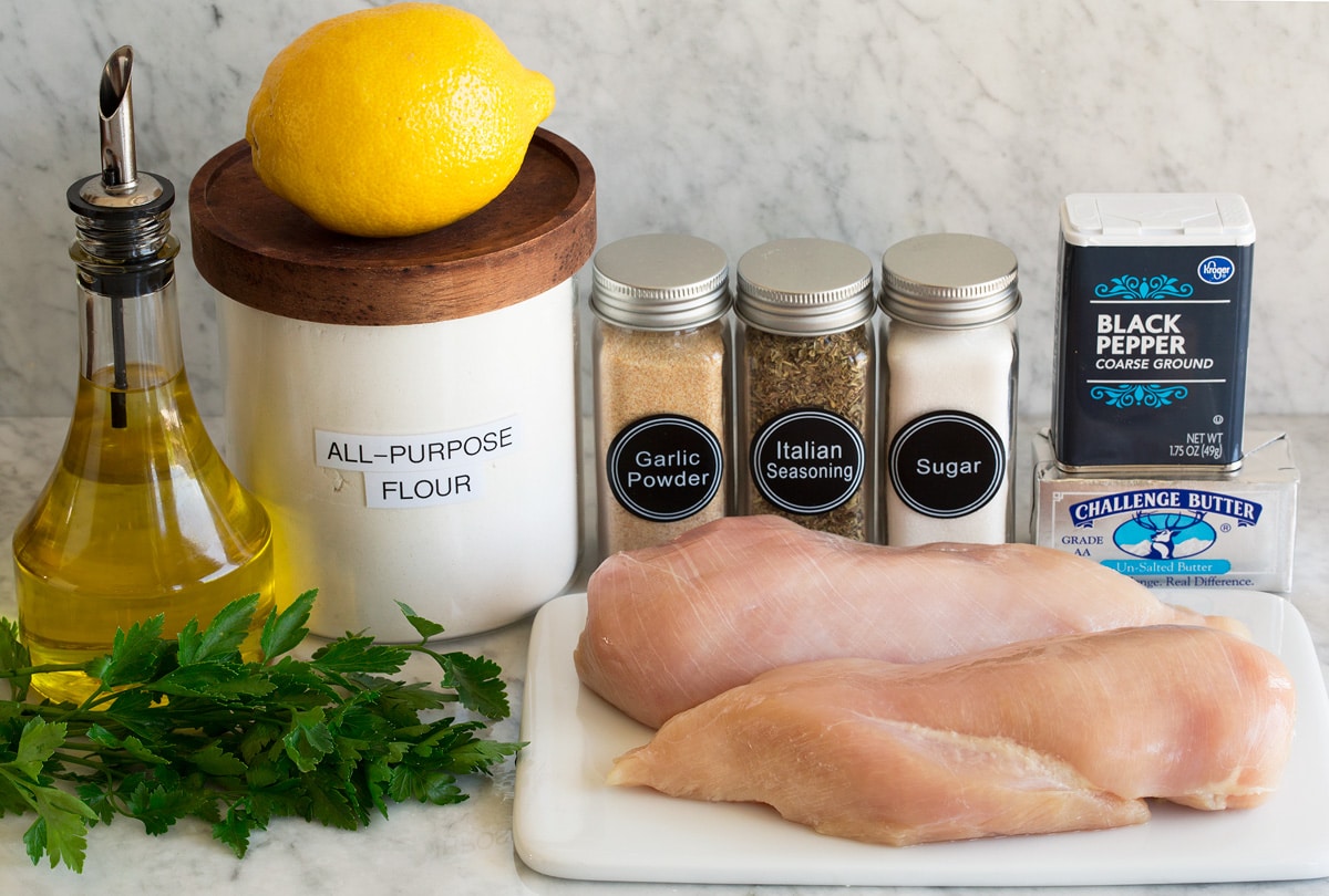 Lemon Pepper Chicken Photo of ingredients used to make lemon pepper chicken. Includes chicken breasts, butter, pepper, sugar, italian seasoning, garlic powder, flour, lemon juice, olive oil, and parsley.