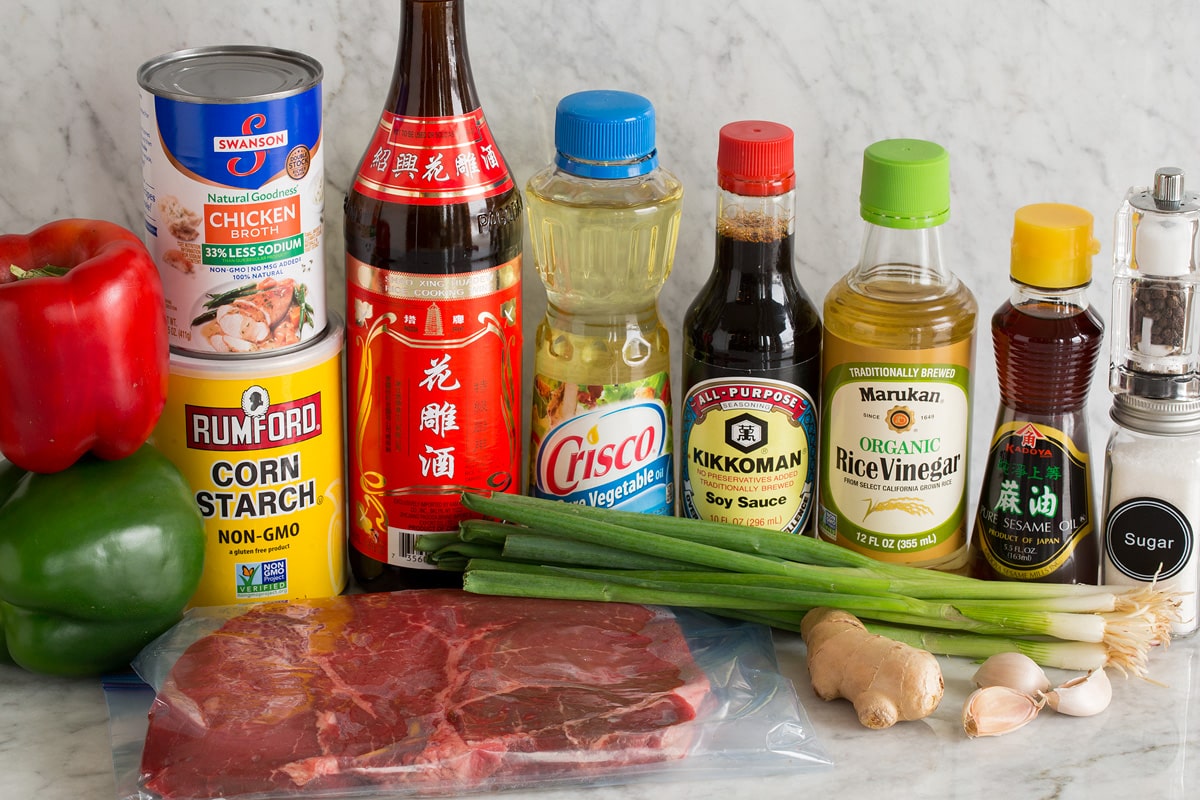 Pepper Steak Photo: Ingredients used to make pepper steak shown here. Includes bell peppers, cornstarch, steak, Chinese vinegar, vegetable oil, soy sauce, rice vinegar, sesame oil, green onions, ginger, garlic, salt, pepper and sugar.
