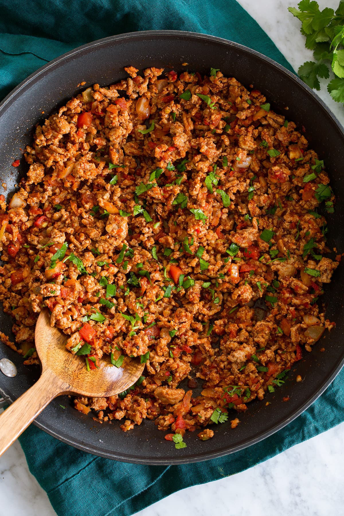 Ground Turkey Tacos Photo: Ground turkey taco meat in a large black skillet shown from above.