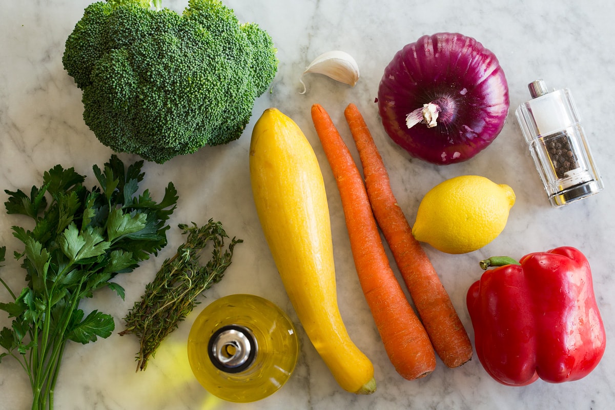 Sautéed Vegetables Photo: Ingredients used to make sauteed vegetables shown on a marble countertop.