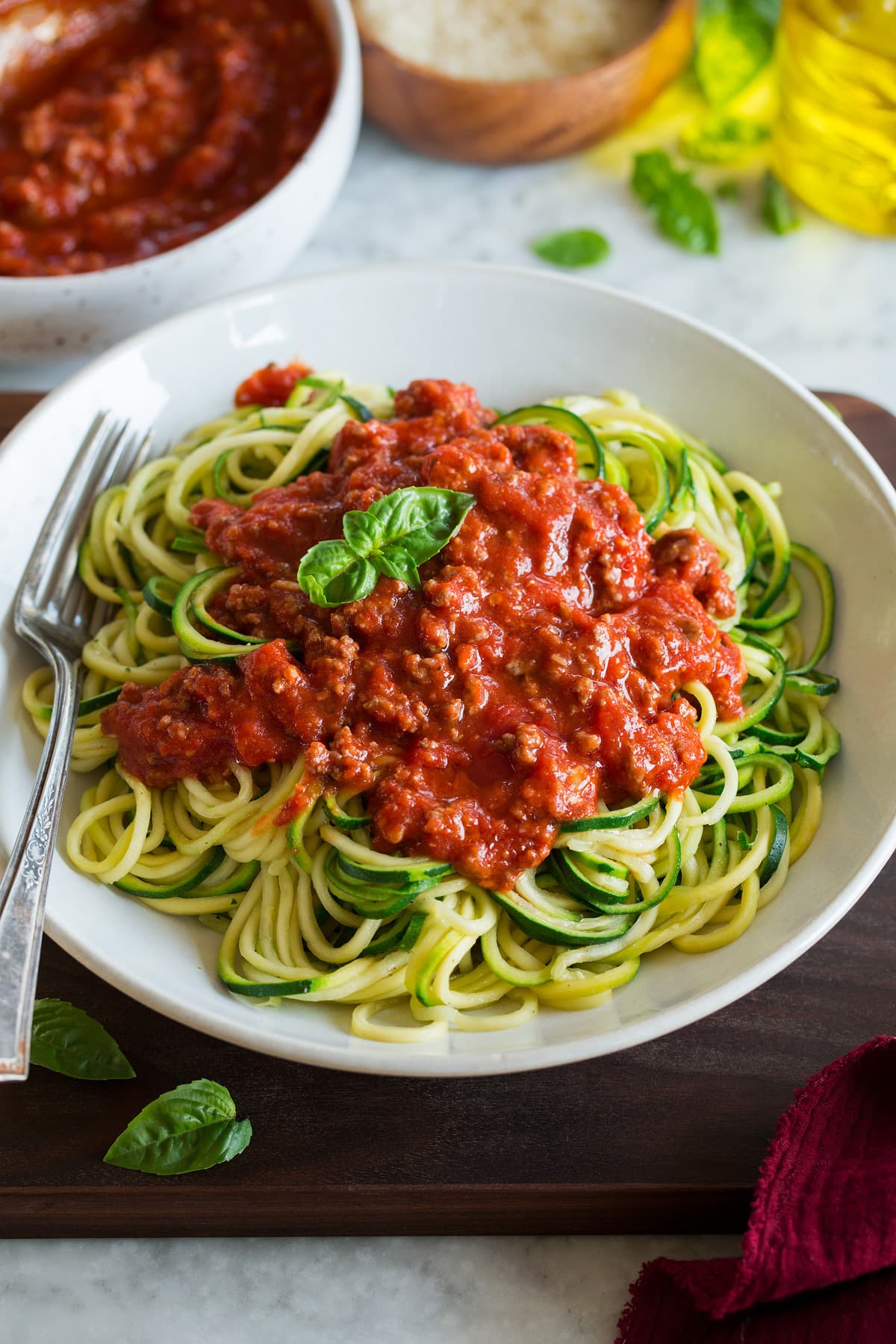 Zucchini Noodles Zucchini Noodles shown topped with a beefy spaghetti sauce.
