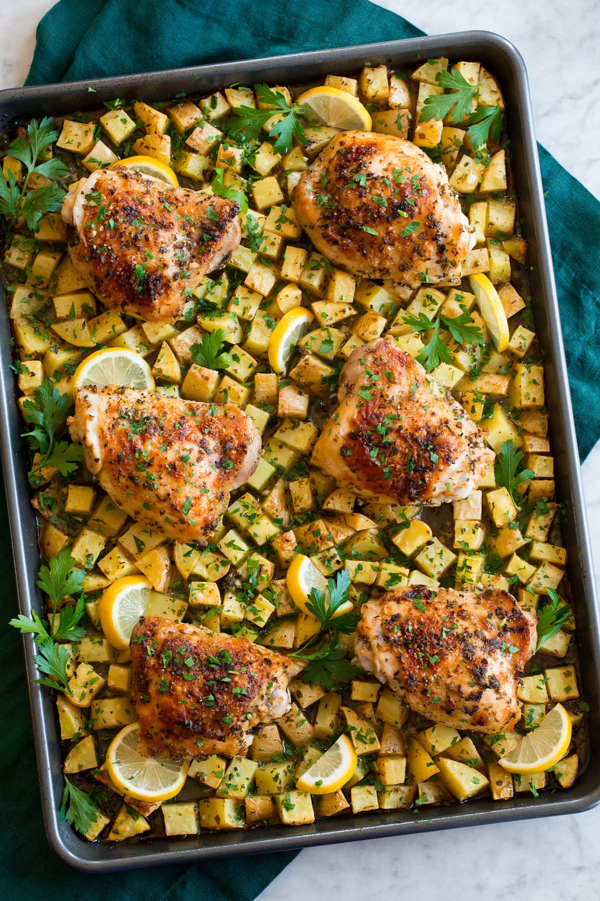 Baked Lemon Chicken and Potatoes Overhead photo of baked chicken and potatoes.