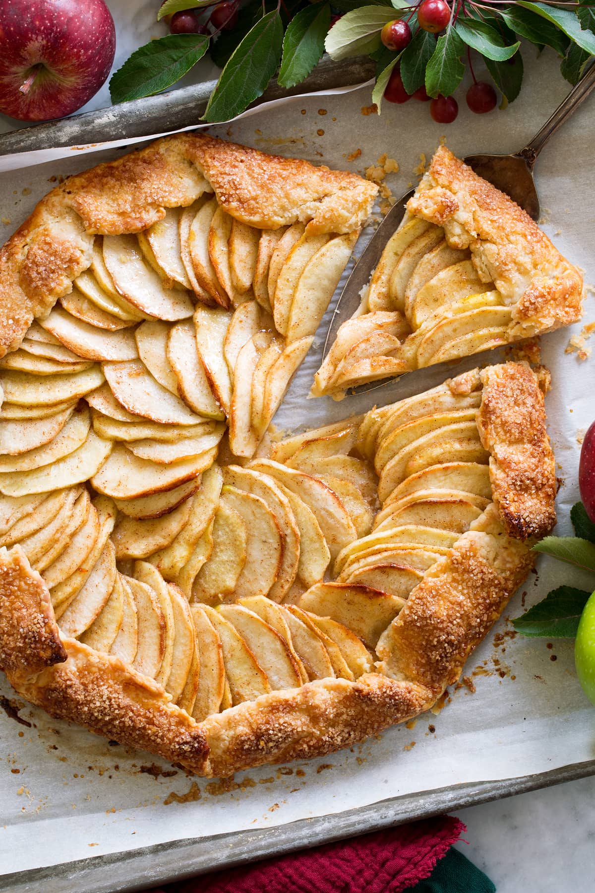 Apple Galette Overhead photo of apple galette with a slice being removed.