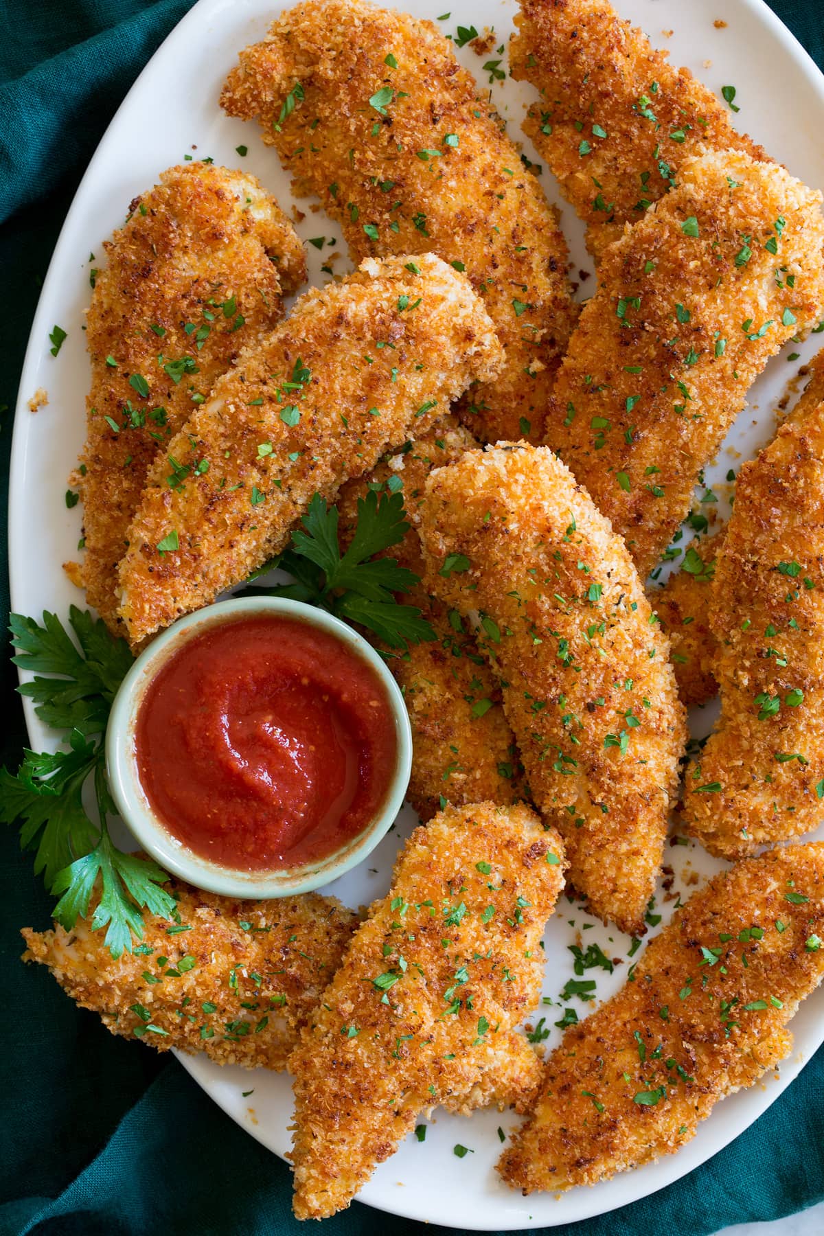 Baked Chicken Tenders Baked chicken tenders served with marinara sauce.