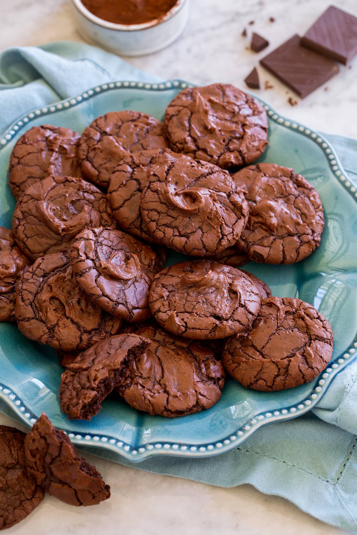 Brownie Cookies Brownie Cookies shown piled together on a turquoise serving plate.