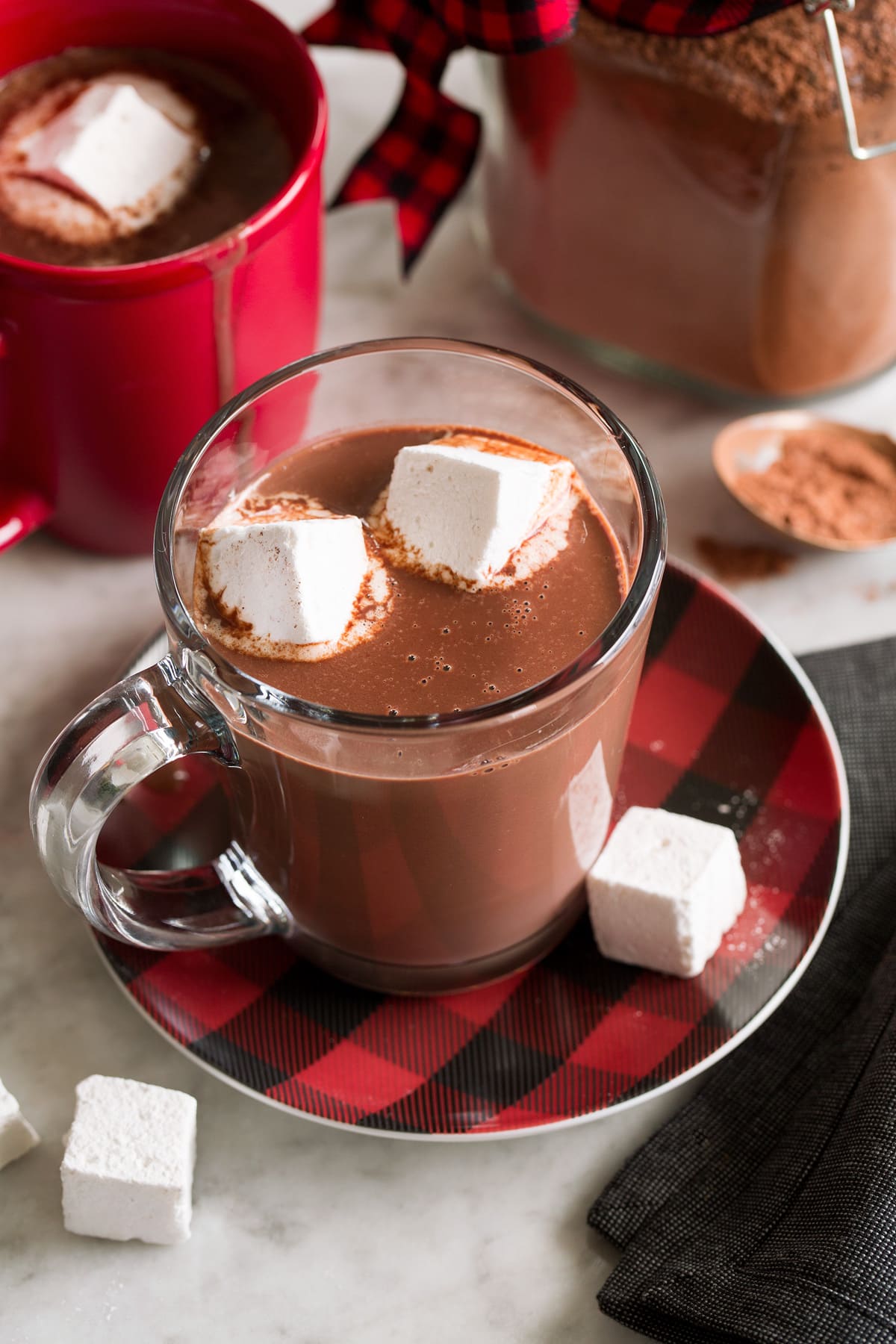 Hot Chocolate Mix Hot chocolate mix shown prepared in a mug with milk and topped with marshmallows.