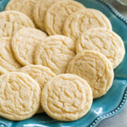 Classic homemade sugar cookies shown on a turquoise plate