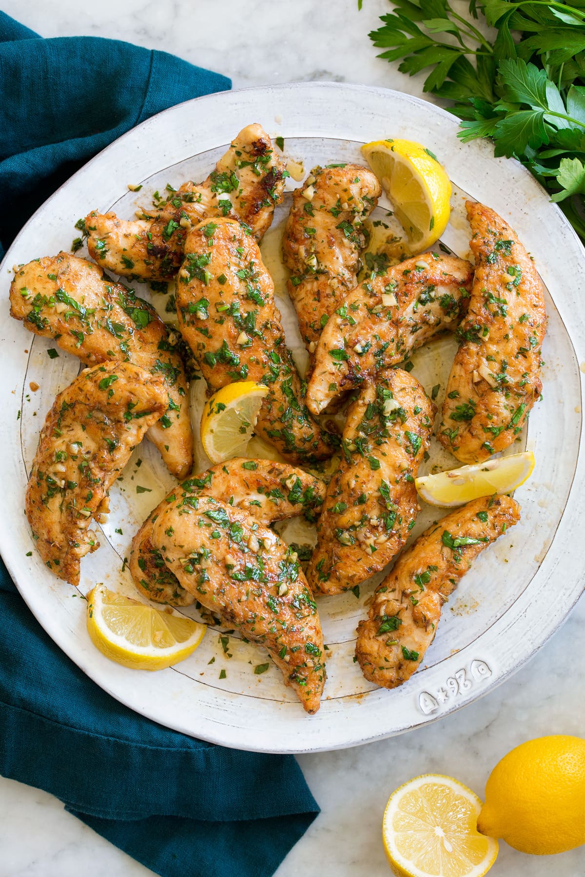 Lemon Butter Chicken Tenders Plate full of pan fried chicken tenders.