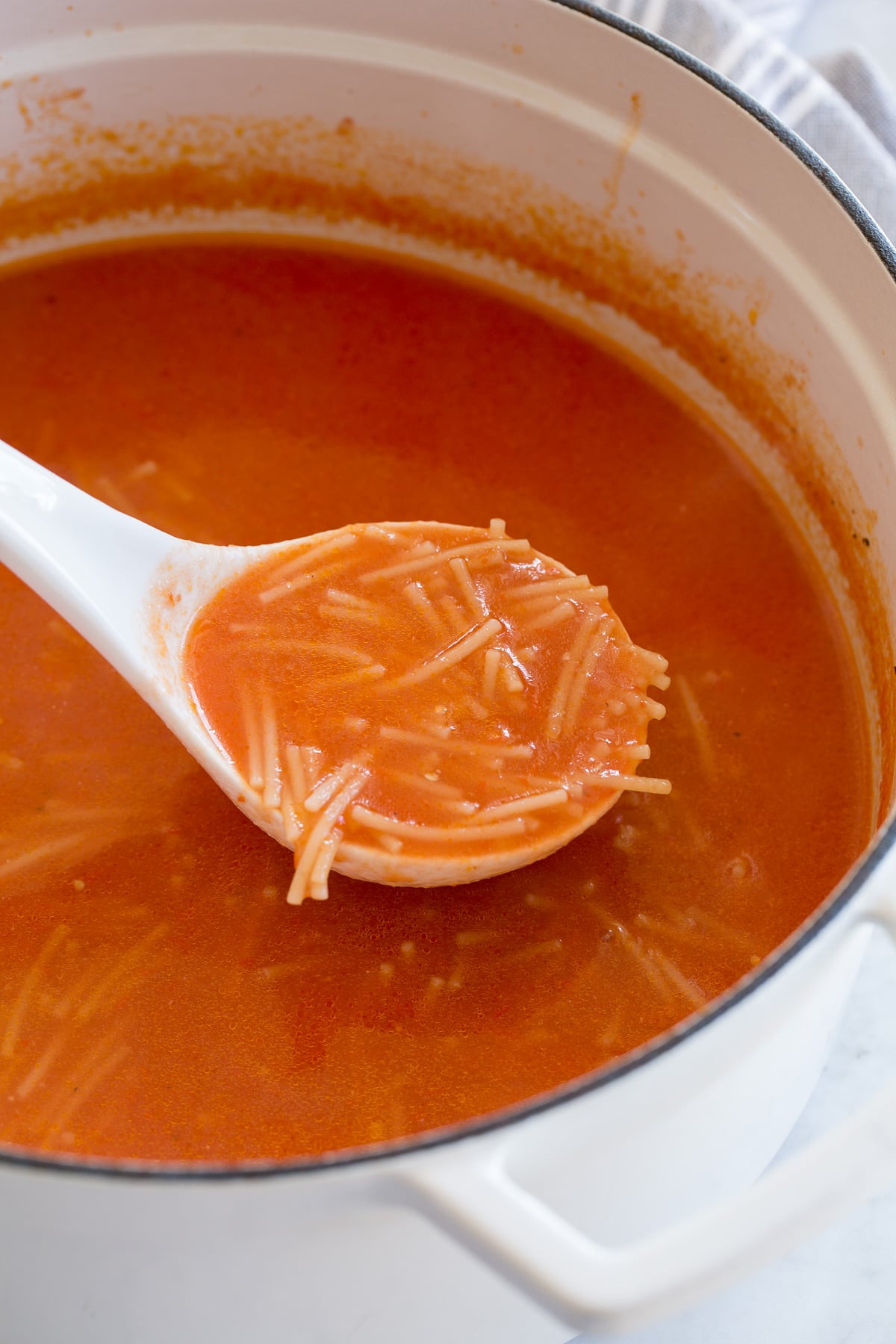 Sopa de Fideo Ladle full of sopa de fideo.