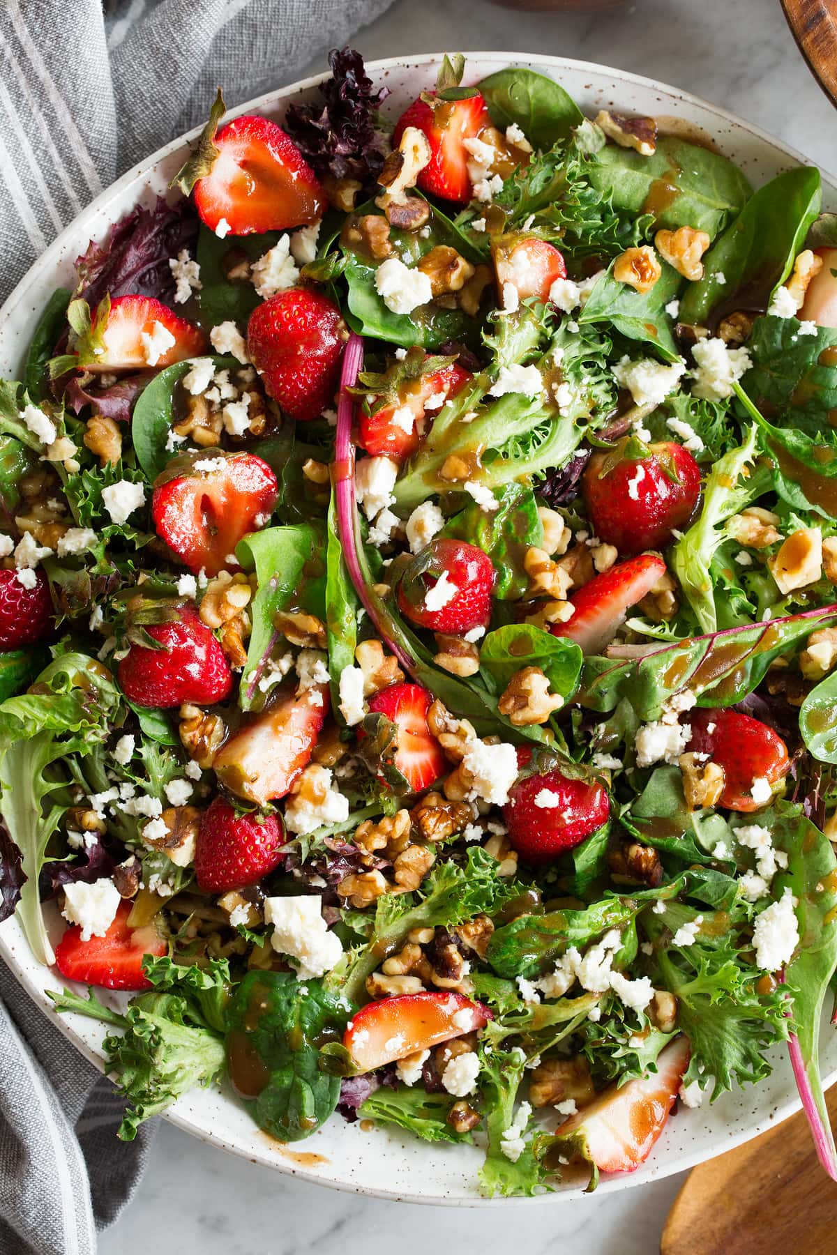 Balsamic Vinaigrette Close up photo of salad drizzled with balsamic vinaigrette dressing.