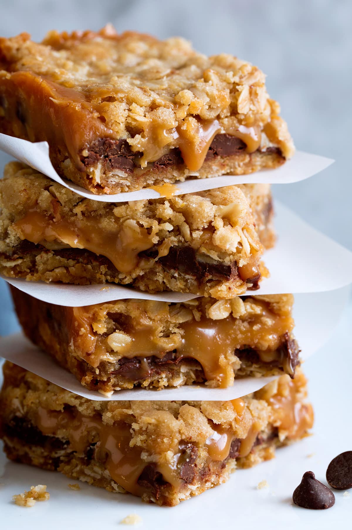 Caramelitas Close up photo of stack of caramel chocolate oatmeal cookie bars.