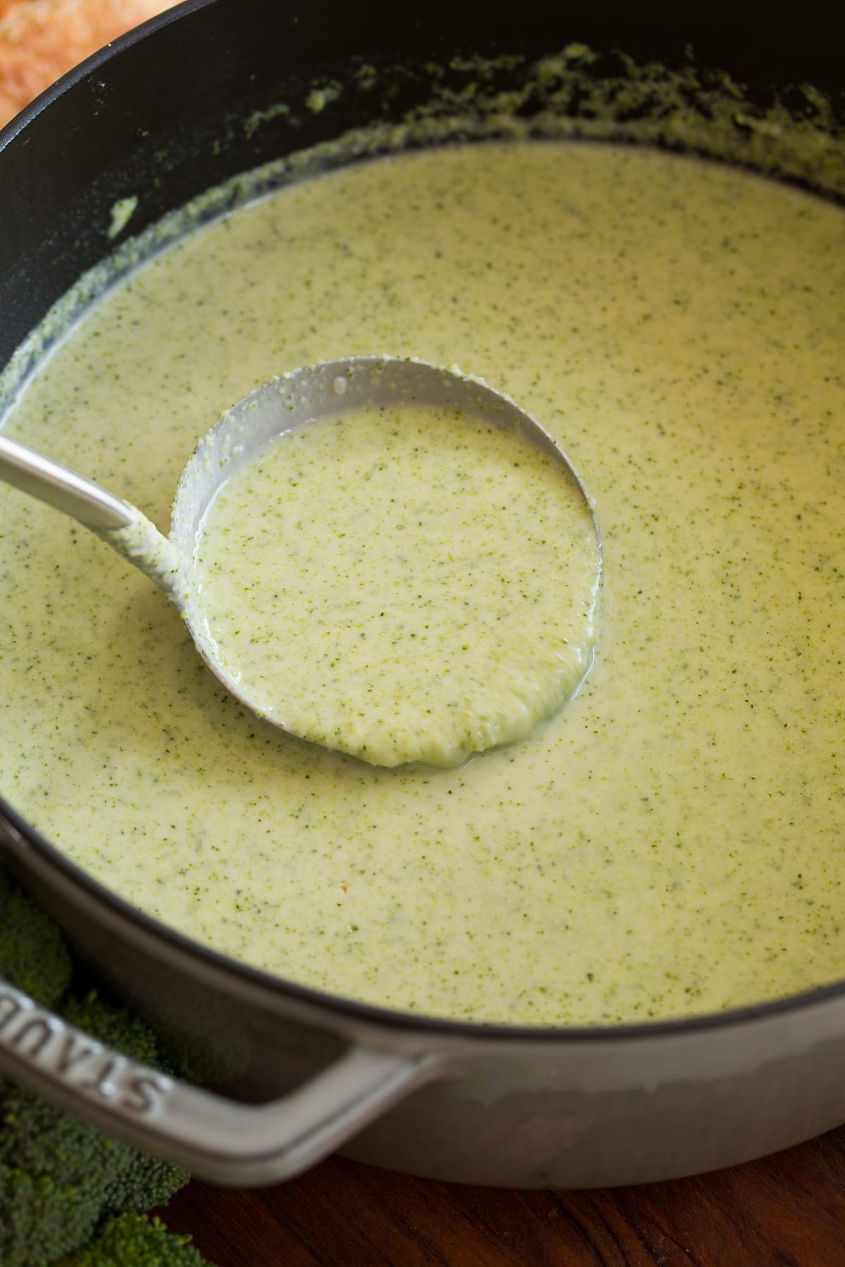 Cream of Broccoli Soup Ladle full of broccoli soup.