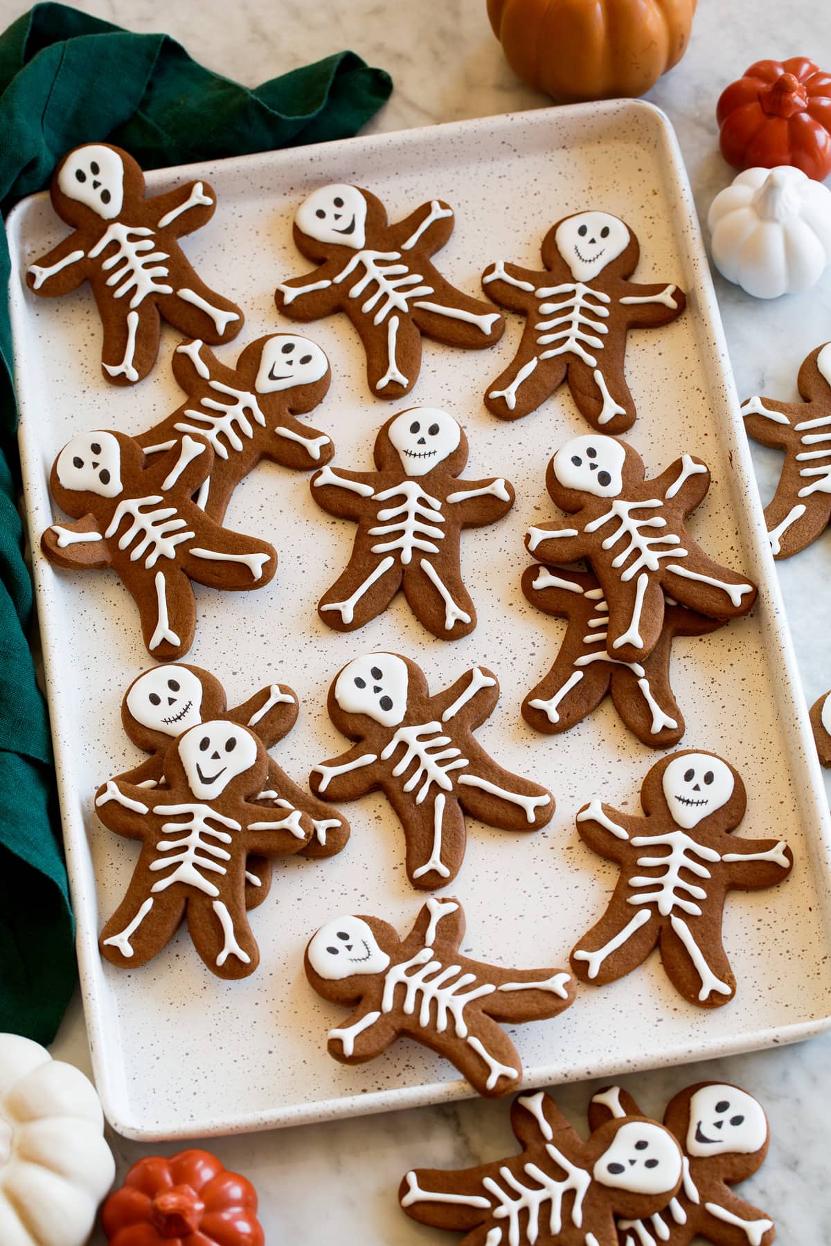 Skeleton Gingerbread Cookies Halloween gingerbread with icing shown from the side on a baking sheet.