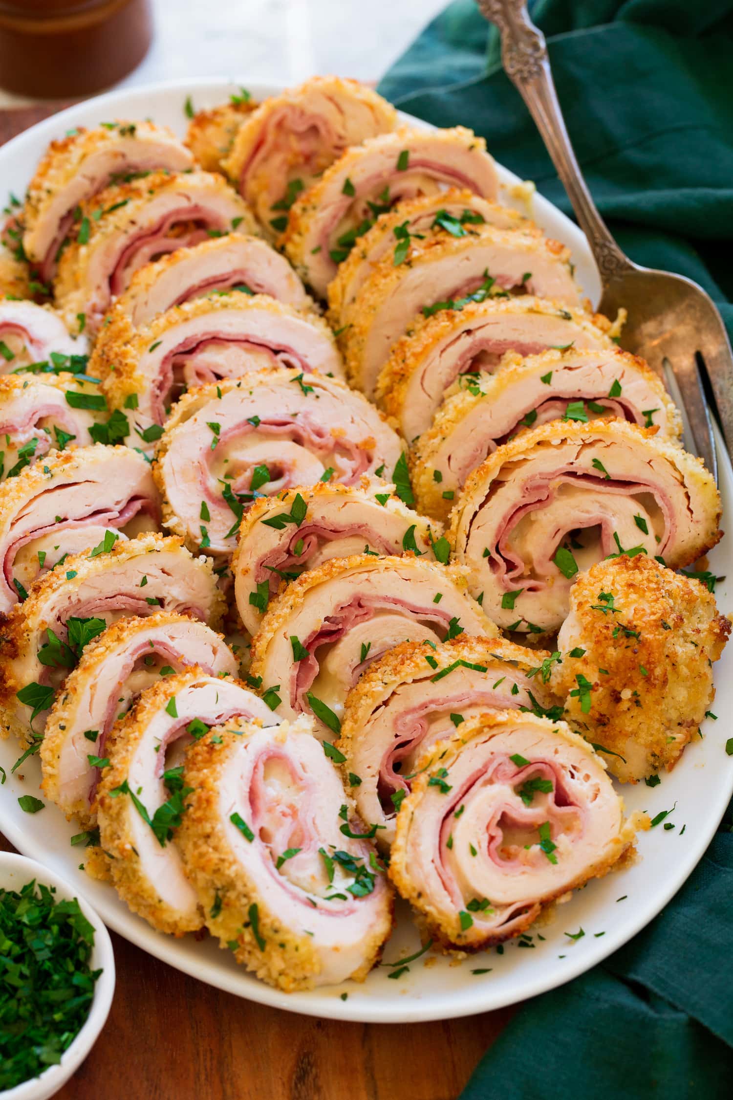 Chicken Cordon Bleu Chicken Cordon Bleu shown sliced on a white serving platter.