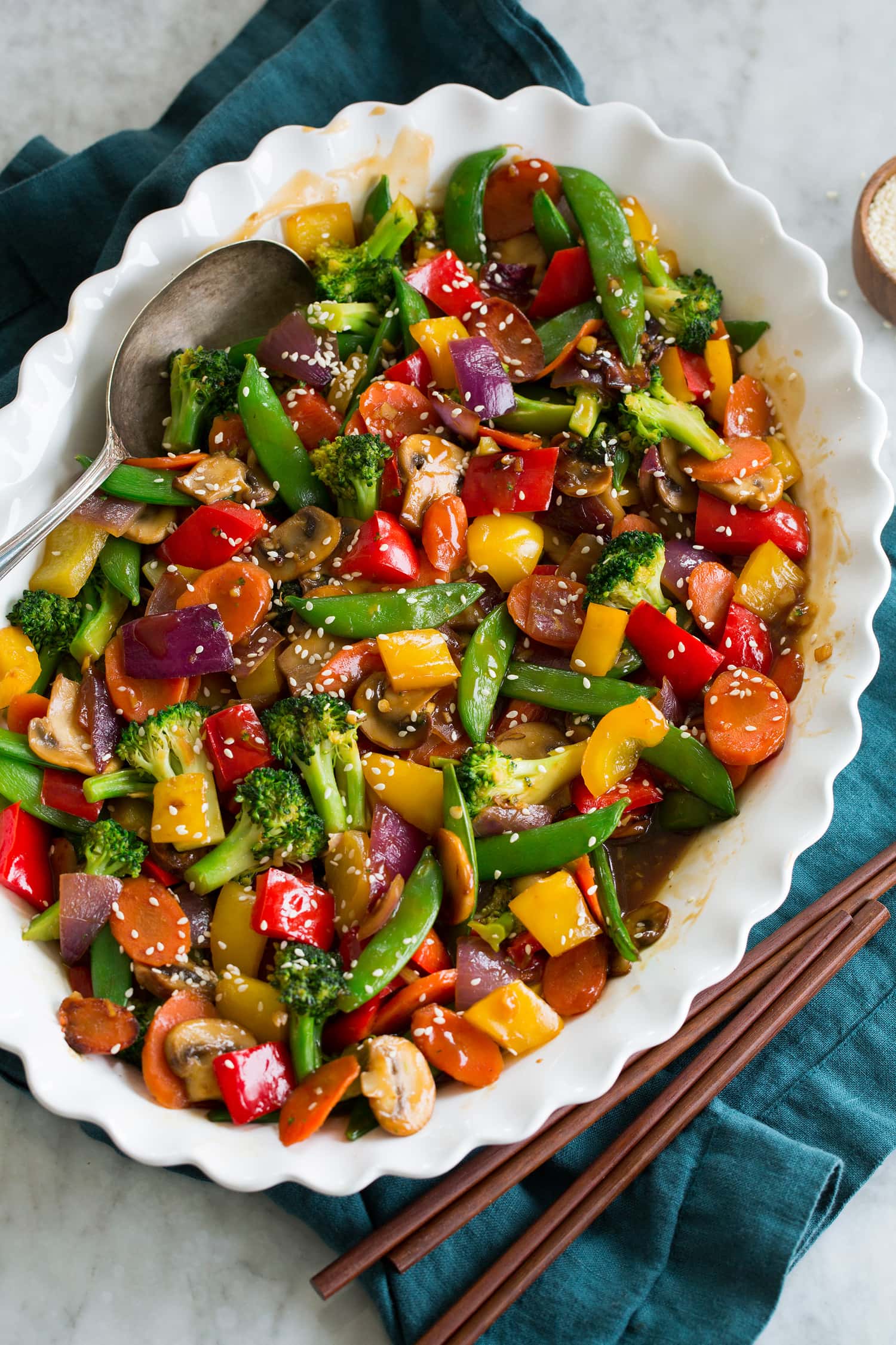 Vegetable Stir Fry Rainbow stir fried vegetables with sauce in a serving dish.