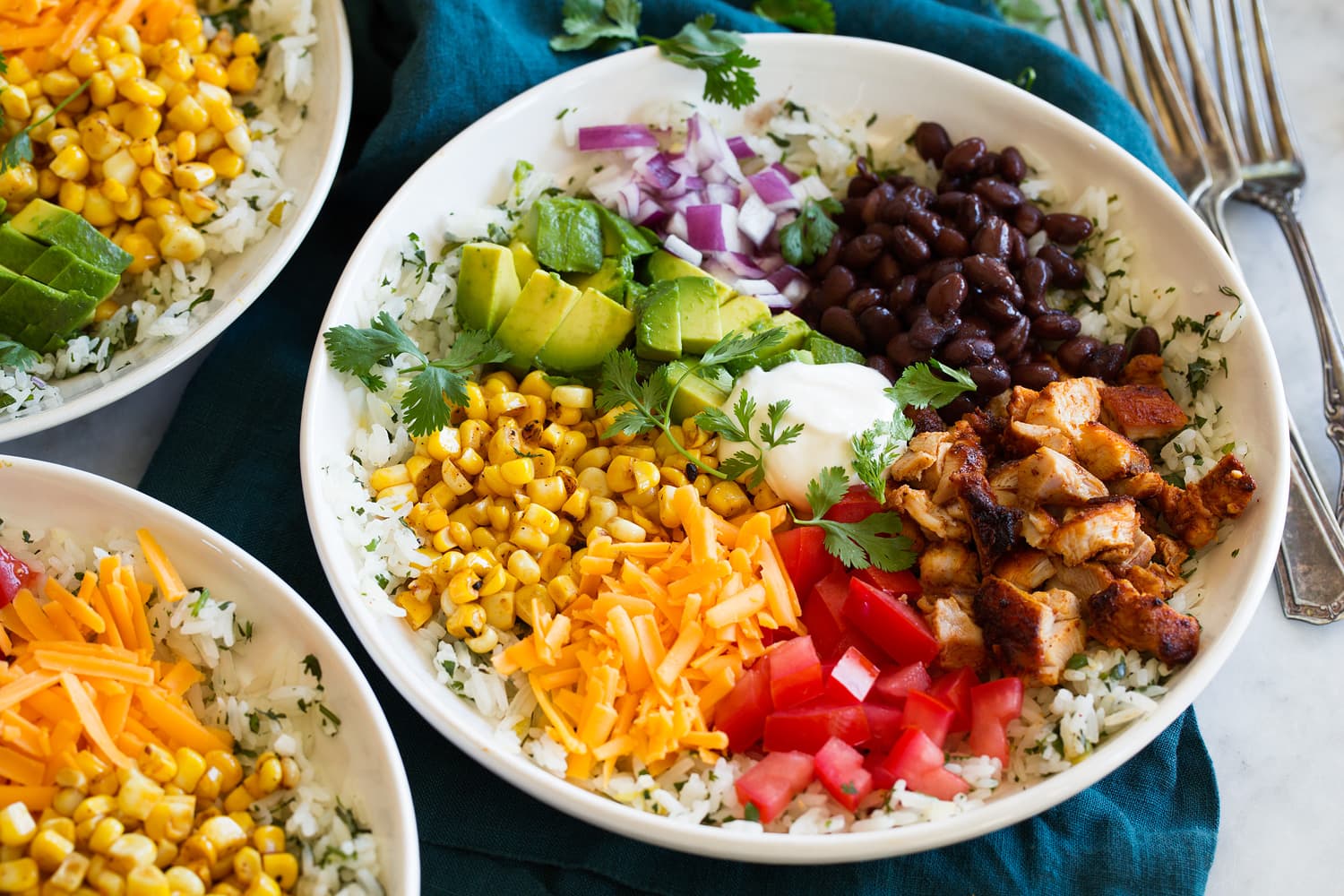 Completed burrito bowl with rice, chicken and toppings. Completed burrito bowl with rice, chicken and toppings.