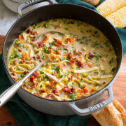 Chicken corn soup in a large grey pot.