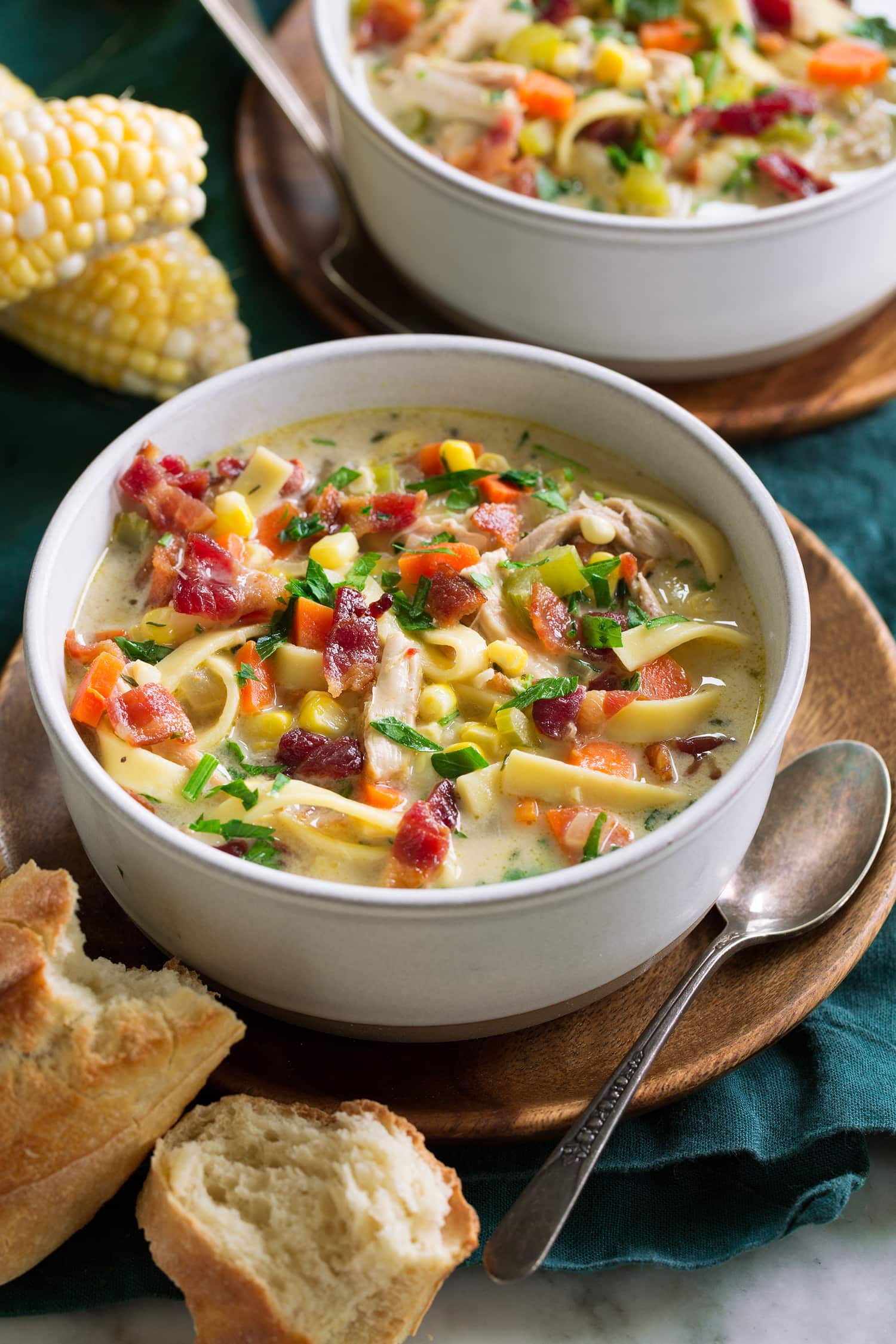 Chicken Corn Soup Serving of chicken soup with corn in a white bowl