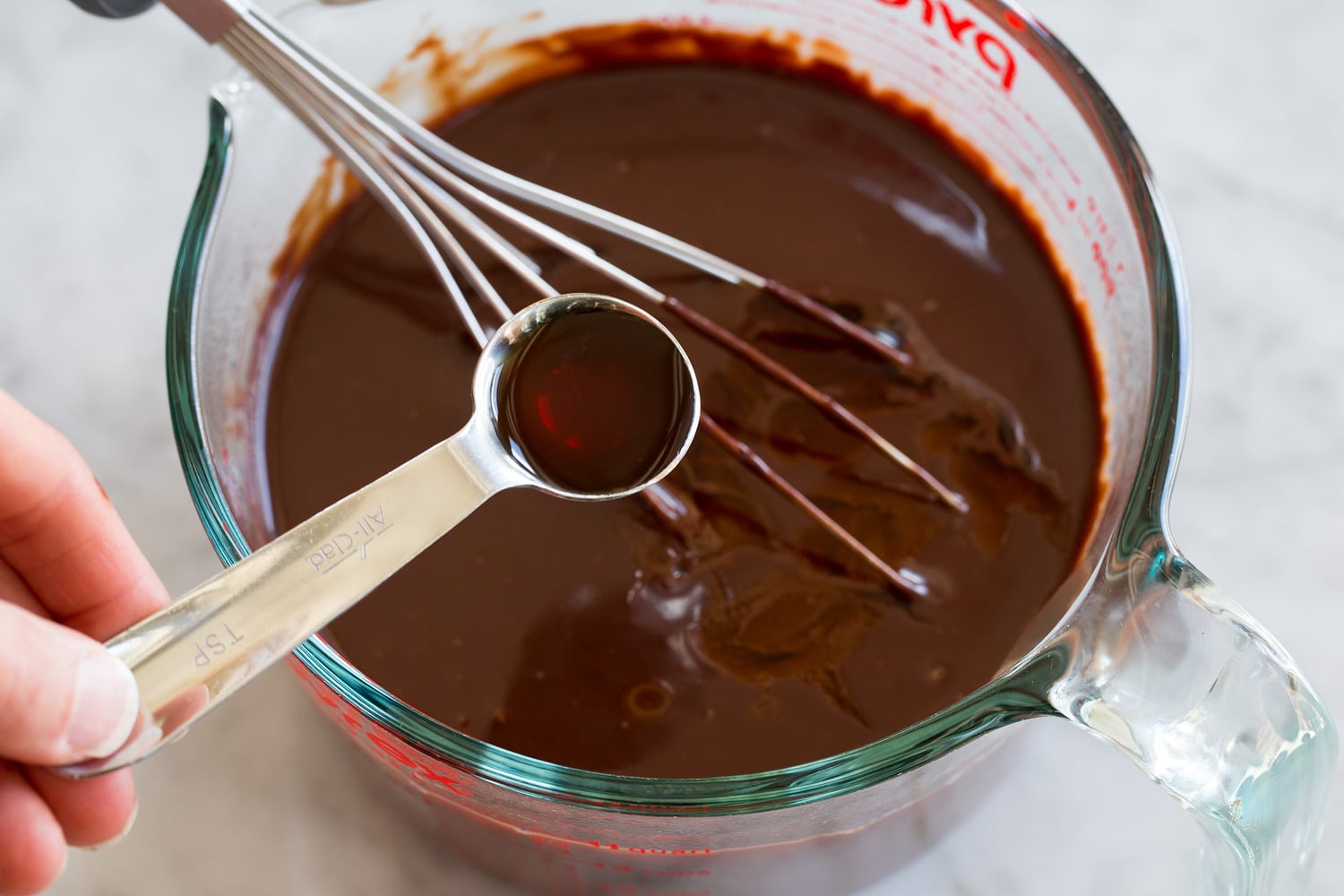 Hot Fudge Sauce Adding vanilla to fudge sauce.