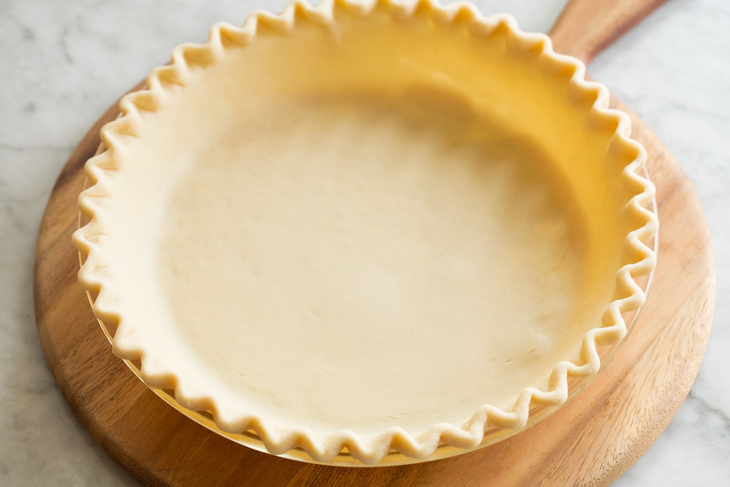 Easy Pumpkin Pie Decorating pie crust in pie dish.