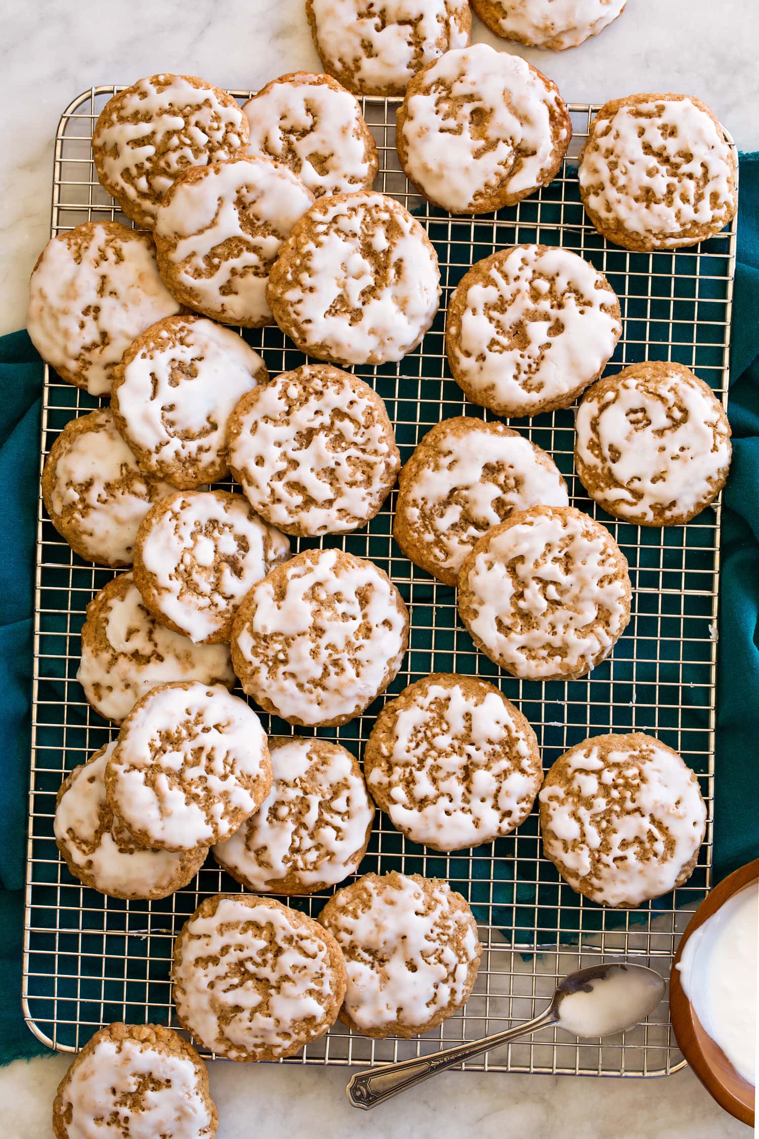 Iced Oatmeal Cookies Iced oatmeal cookies on a wire rack.