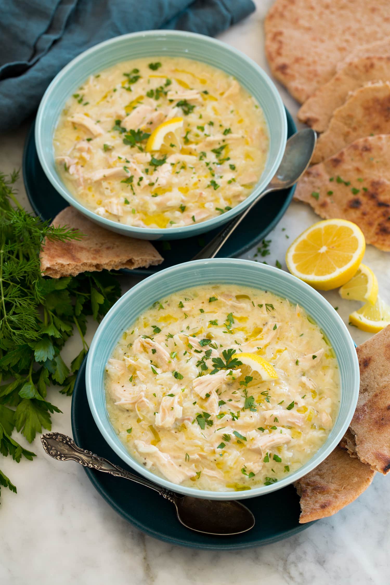 Avgolemono Soup Greek lemon chicken soup served with pita bread.