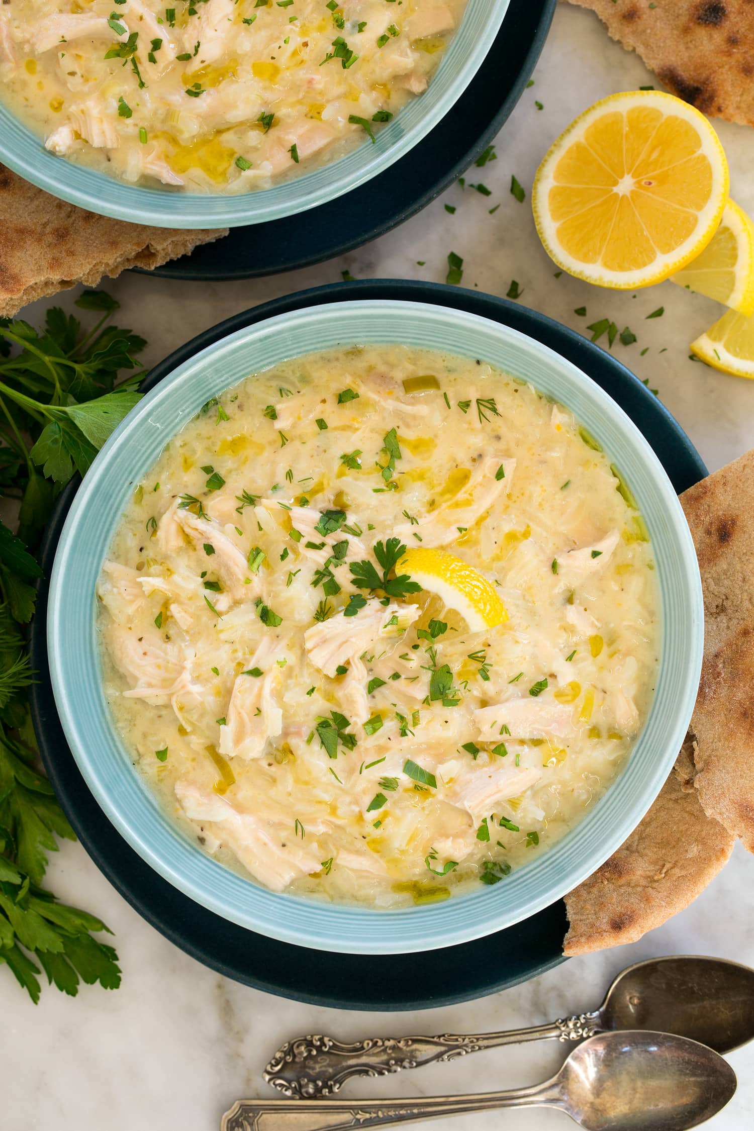 Avgolemono Soup Overhead photo of greek lemon chicken rice soup.
