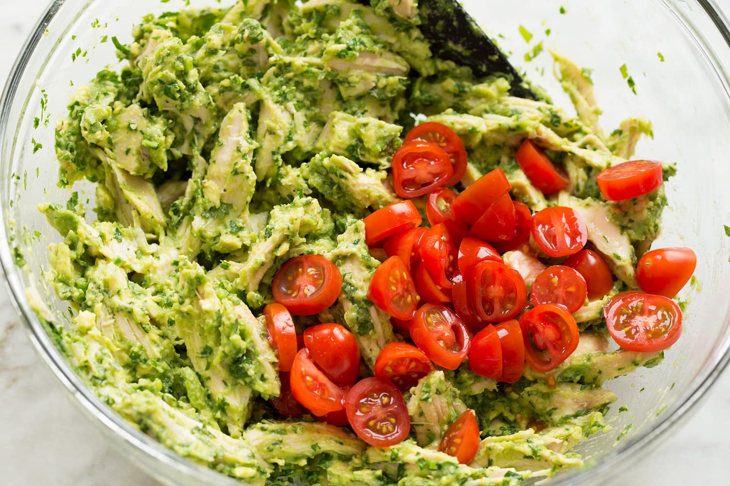 Avocado Chicken Salad Adding tomatoes to chicken salad.