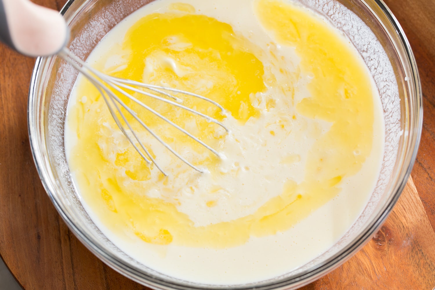 Sheet Pan Pancakes Adding butter to wet mixture.