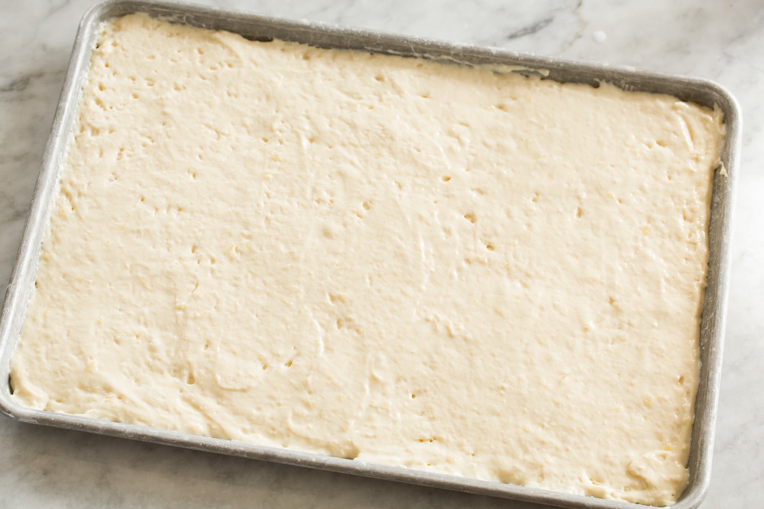 Sheet Pan Pancakes Pancake mix poured into baking sheet.