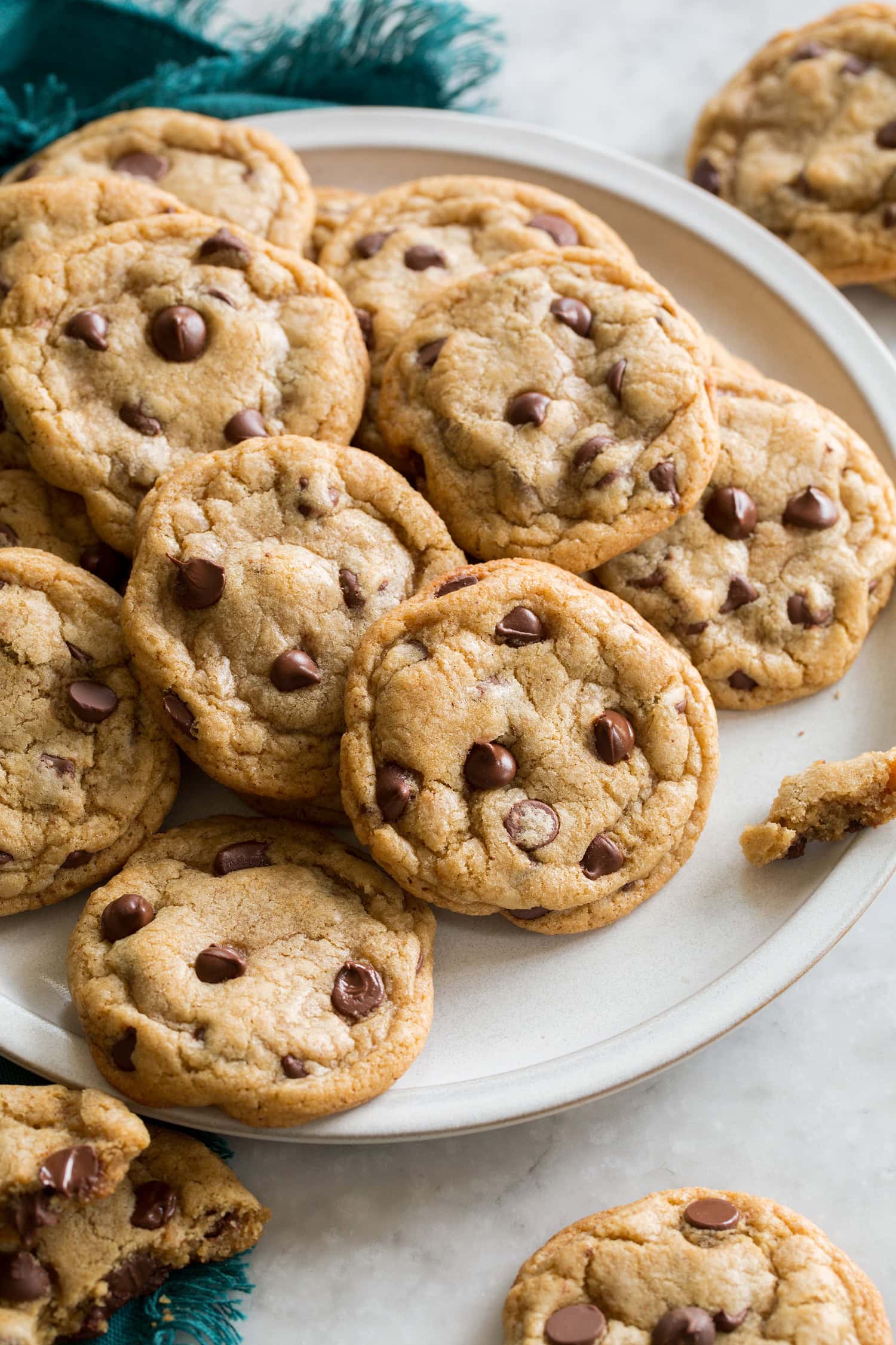 Brown Butter Chocolate Chip Cookies Plate full of browned butter chocolate chip cookies overlapping.