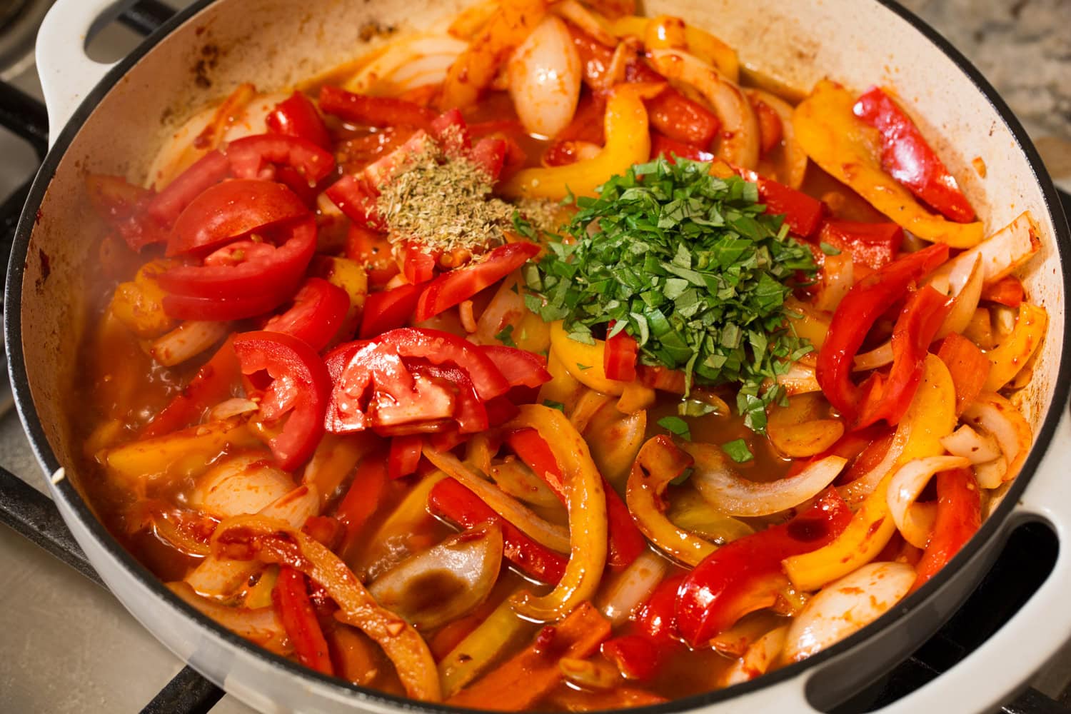 Italian Sausage Peppers and Onions Tomatoes, basil and oregano added to sauteed peppers mixture.