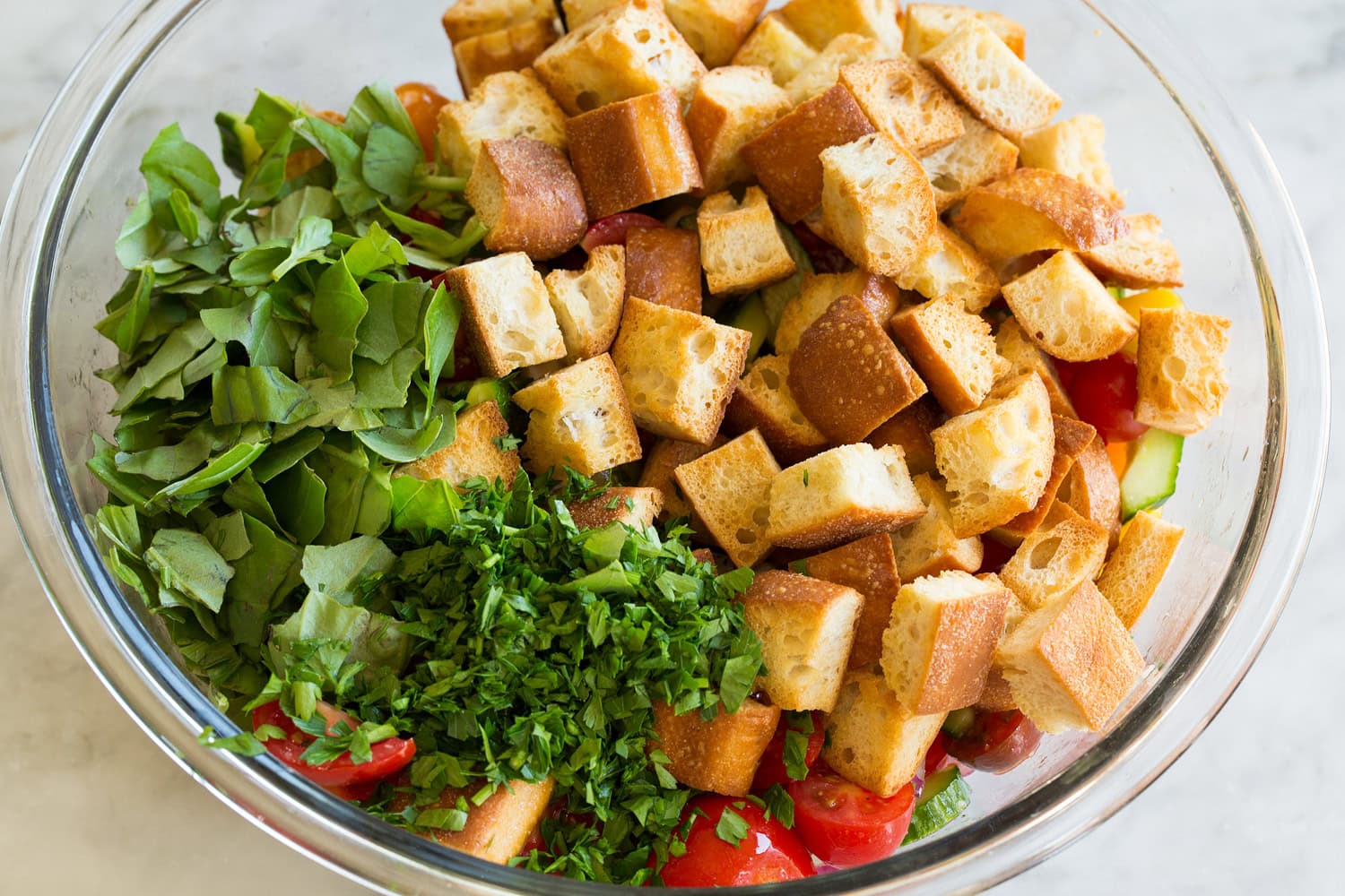 Panzanella Salad Toasted bread and herbs added to salad.
