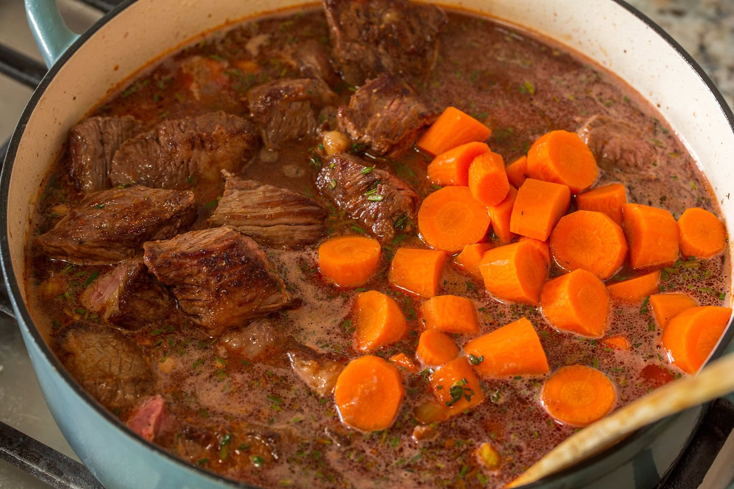 Beef Bourguignon Browned beef chuck and carrots added to stew.