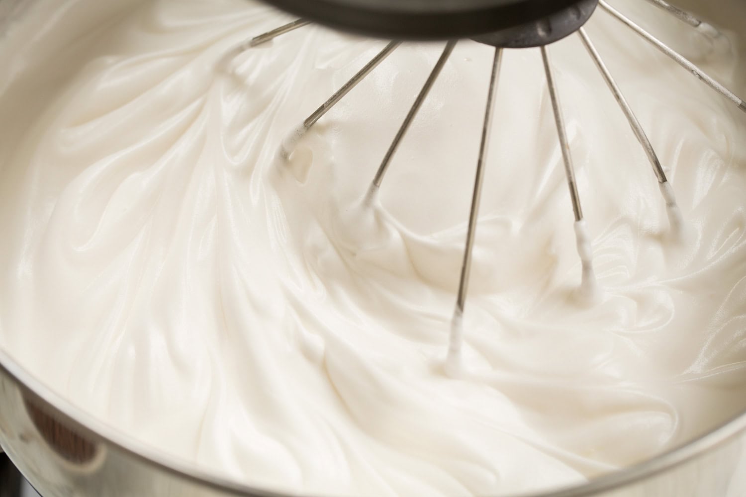 Chocolate Angel Food Cake Whipped egg whites with sugar in stand mixer.