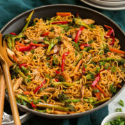 Stir fry noodles with bell peppers, carrots, broccoli, mushrooms and chicken.