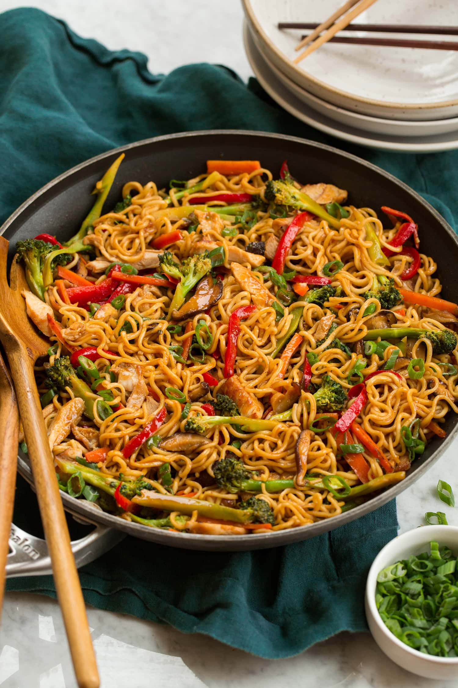Stir fry noodles with bell peppers, carrots, broccoli, mushrooms and chicken.