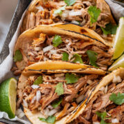 Close up photos of carnitas in tortillas.