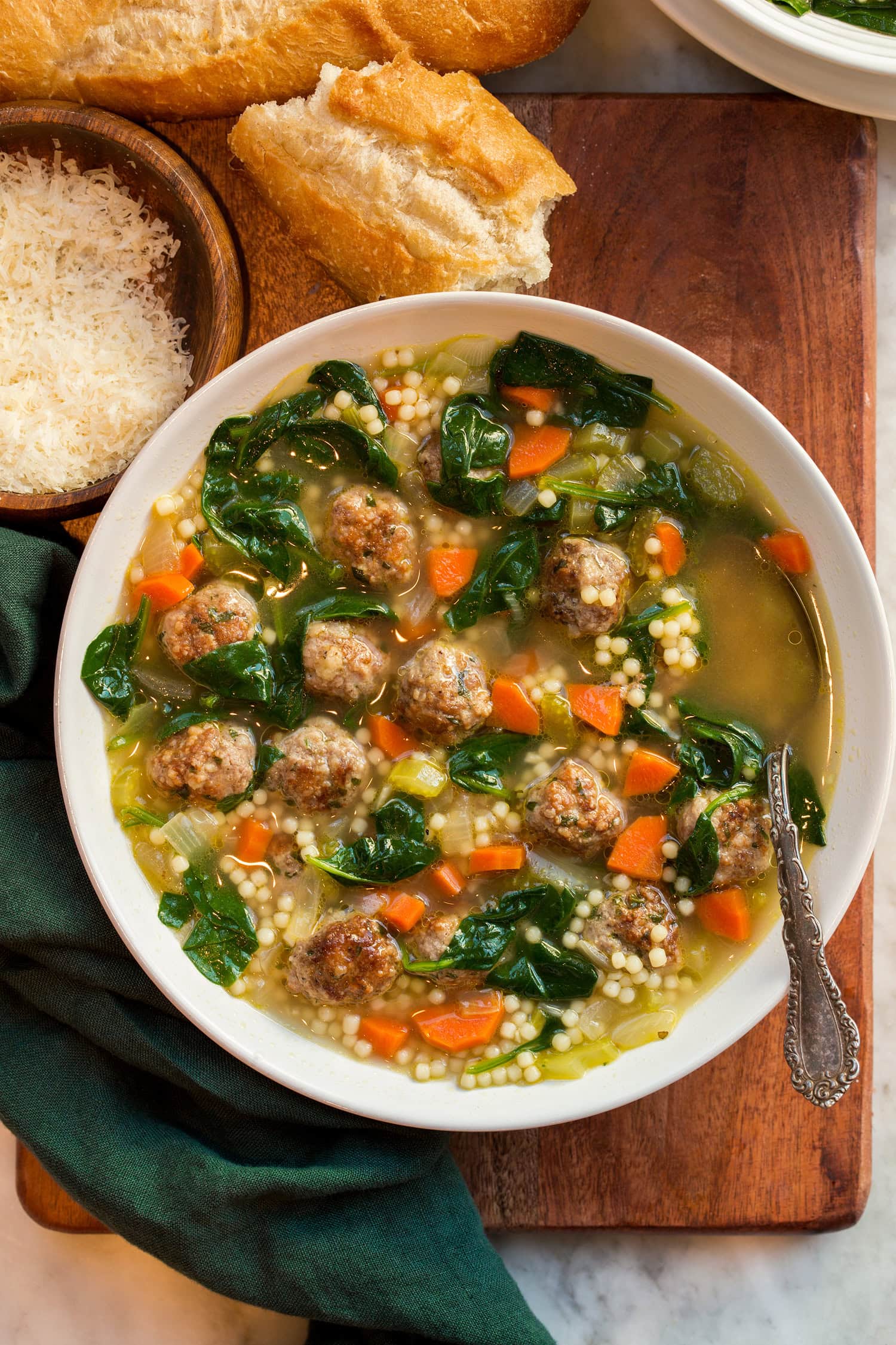 Italian Wedding Soup Overhead photo of single serving of Italian wedding soup.
