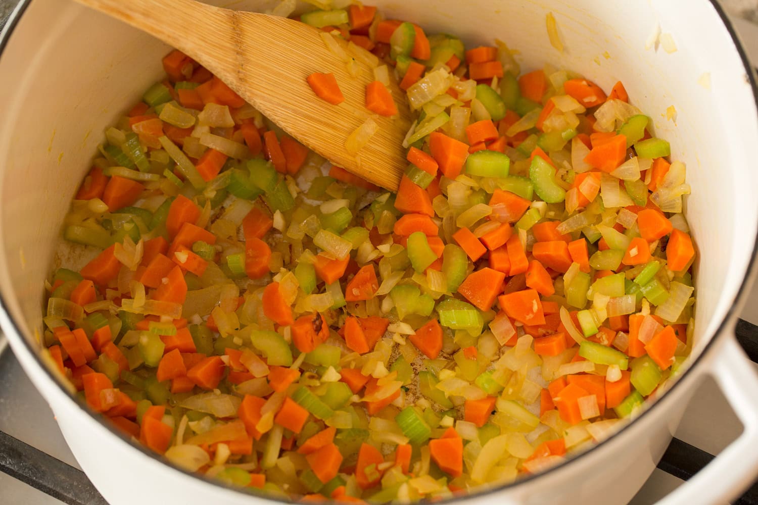 Italian Wedding Soup Veggies sauteed in a large pot.