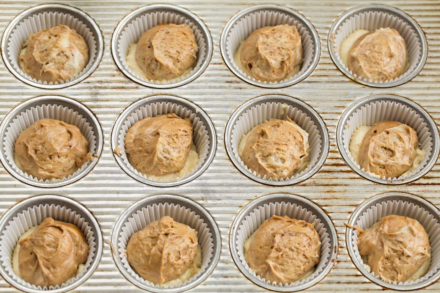 Tiramisu Cupcakes Espresso cupcake batter added to muffin pan.