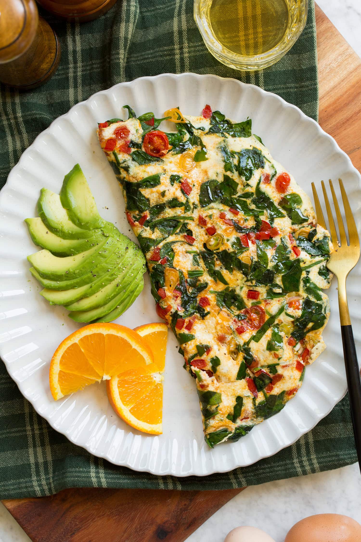 Egg White Omelette Egg white omelette on a scalloped white ceramic plate.