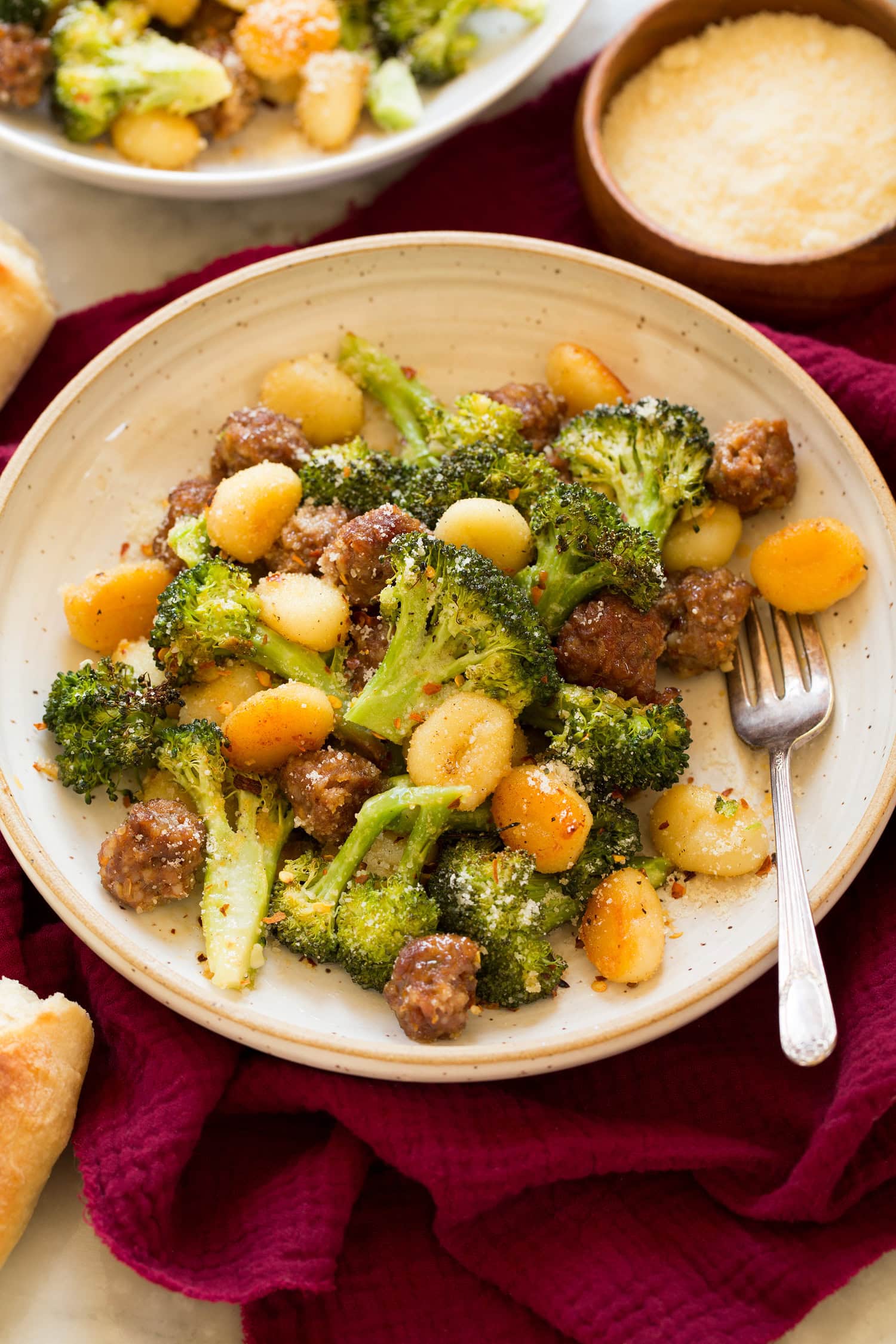 Sheet Pan Gnocchi with Sausage and Broccoli Serving of oven gnocchi with roasted broccoli and sausage.