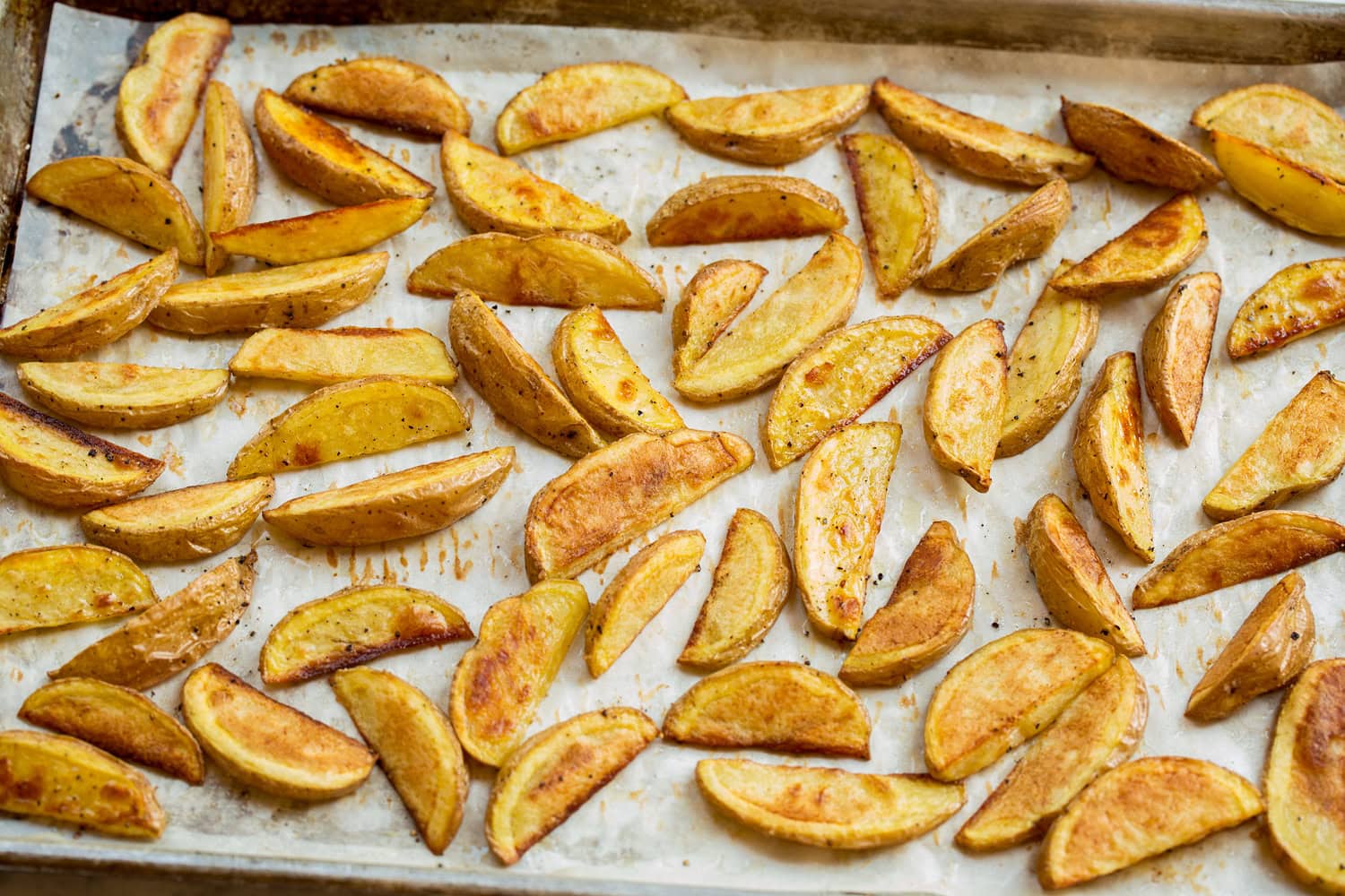 Burger Bowls Oven fries shown after baking on baking sheet.